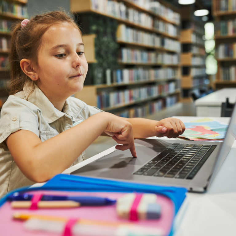 student-in-library-using-laptop-and-reading-cloud